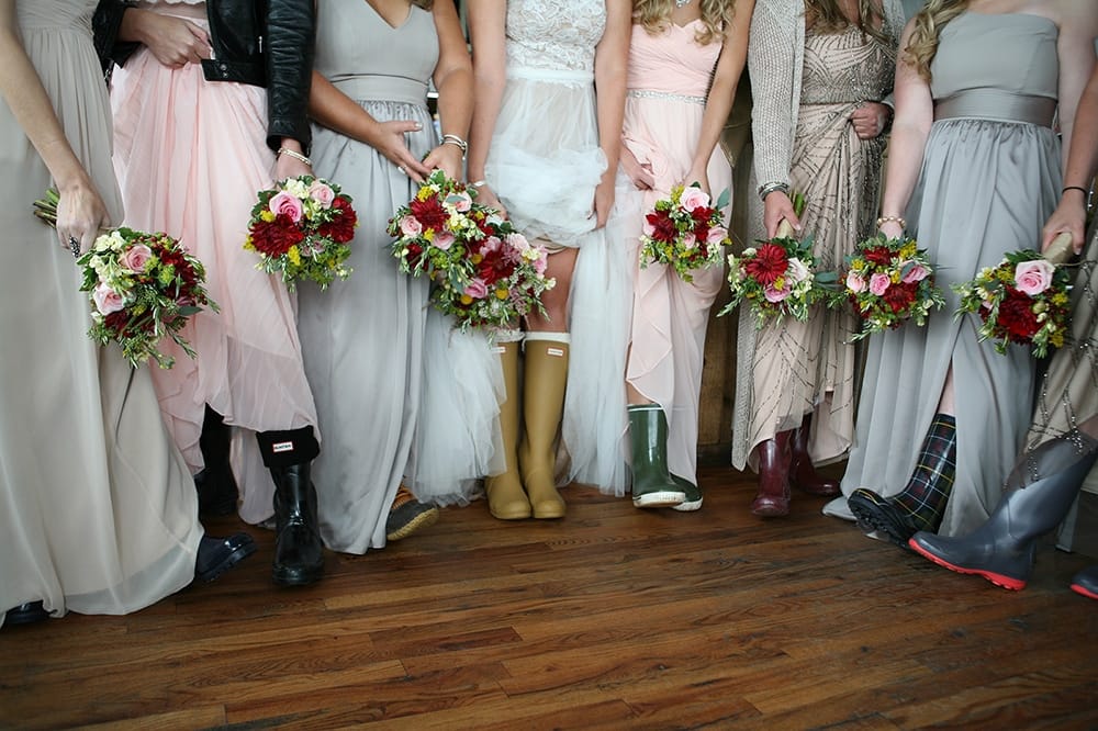 bride bridesmaids bouquets and rain boots, bouquets of astilbe, roses, dahlias, billy balls