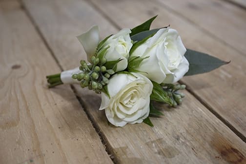 white spray rose boutonniere, boutonniere, long island wedding flowers, groom boutonniere, groomsmen boutonniere, seeded eucalyptus