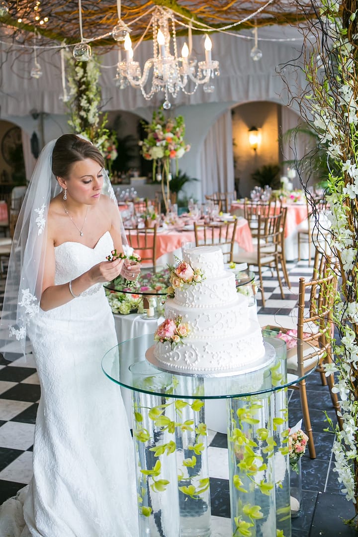 chelsea mansion bride decorating cake with flowers